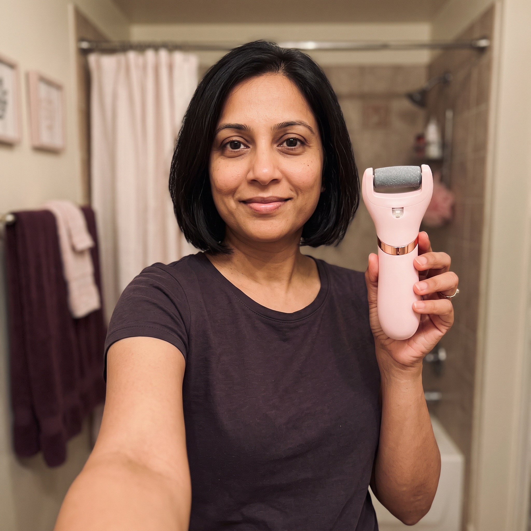 Priya S. holding Bare Sunday in a bathroom selfie